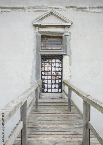 Fototapeta Naklejka Na Ścianę i Meble -  Old window and door with rusty bars