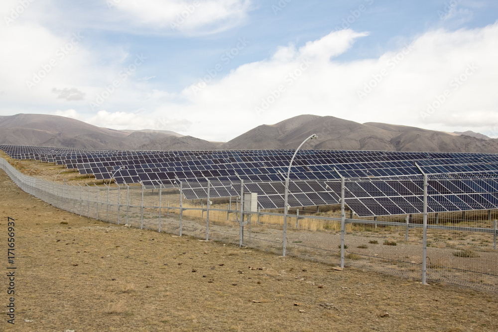 solar farm in the mountains under the cloudy sky solar farm in the mountains under the cloudy sky