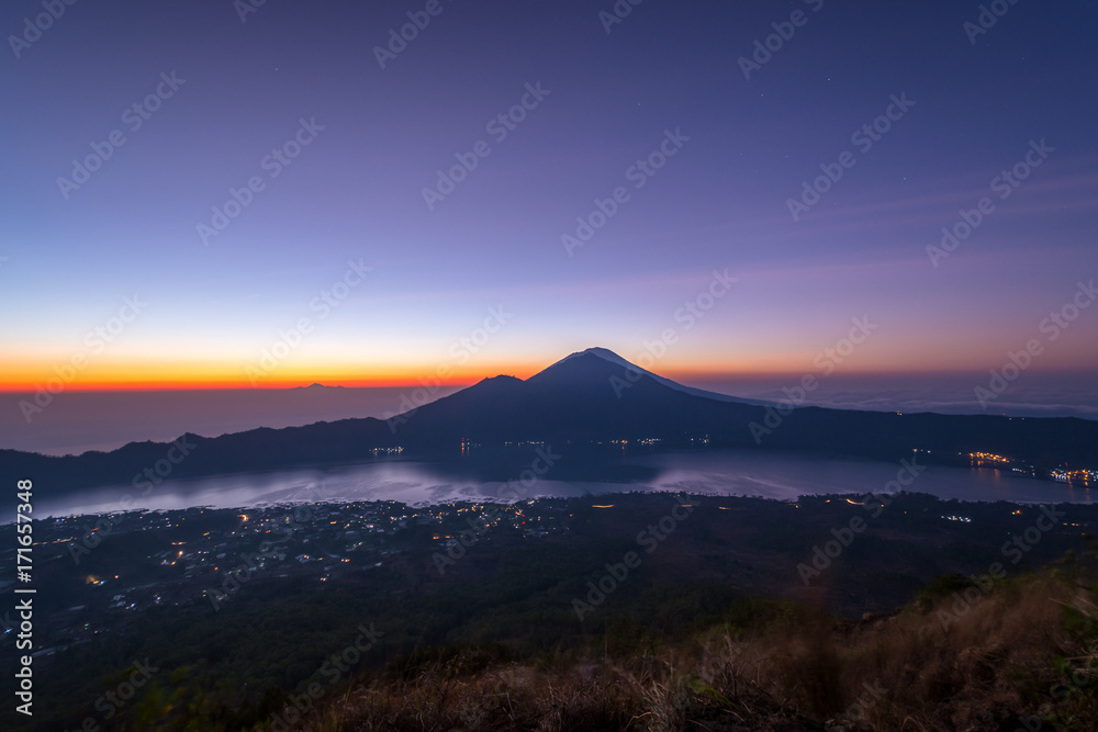 Active volcano Mount Gunung Batur at sunrise in Bali, Indonesia.