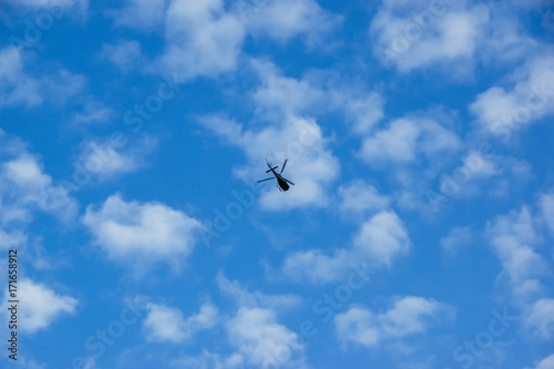 Helicopter flies in the sky
