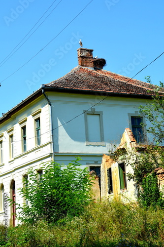 Typical rural landscape and peasant houses in  the village Somartin, Martinsberg, Märtelsberg, Transylvania, Romania.  photo