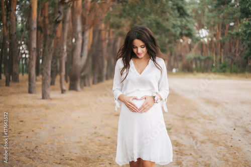 Pregnant girl in white dress