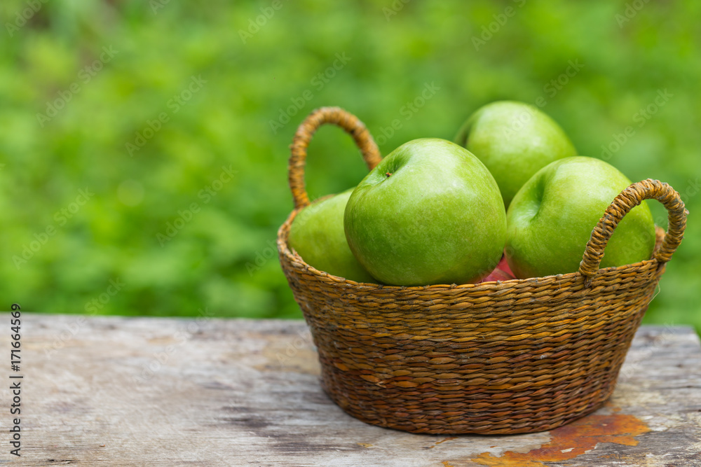 red and green apples with flowers on wooden red and green apples with flowers on wooden