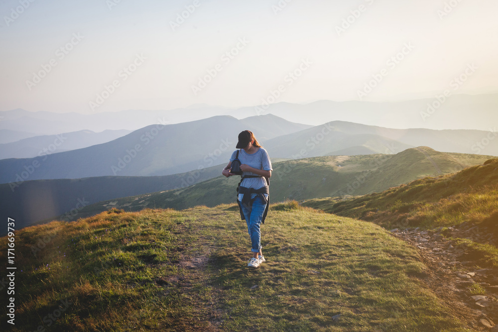 Girl Hiker Walks into Carpathian Mountains
