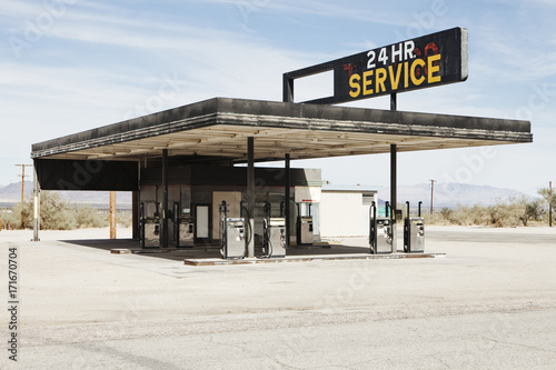 Abandoned gas station in Mojave Desert, near Surprise Valley, CA photo