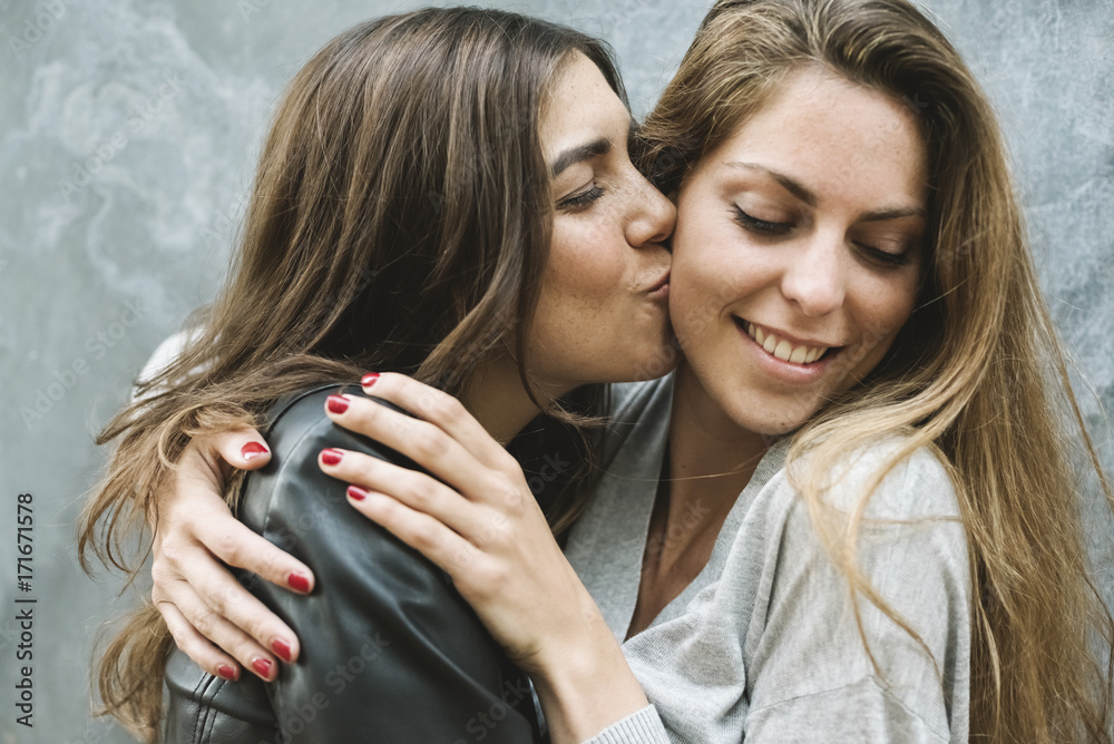 Best girl friends kissing and hugging each other Stock Photo Adobe Stock