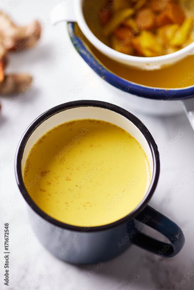 Close-up of yellow turmeric tea in mug Close-up of yellow turmeric tea in mug