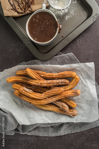 Bild auf Leinwand Traditional Spanish and Mexican dessert churros with hot chocolate sauce