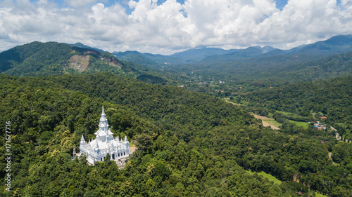 Aerial top view photo from flying drone of the Buddhist temple and fields in the countryside of Chiang Mai, Northern Thailand