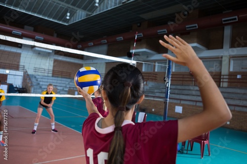 Photography Female players playing volleyball in the court