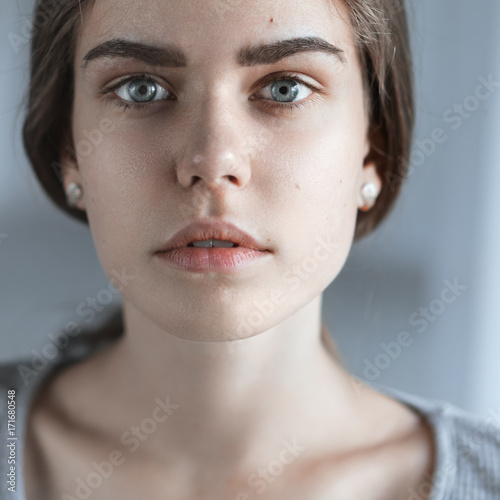 portrait of a beautiful young girl with perfect skin