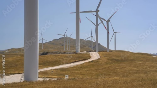 Windmills converting wind energy into electricity photo