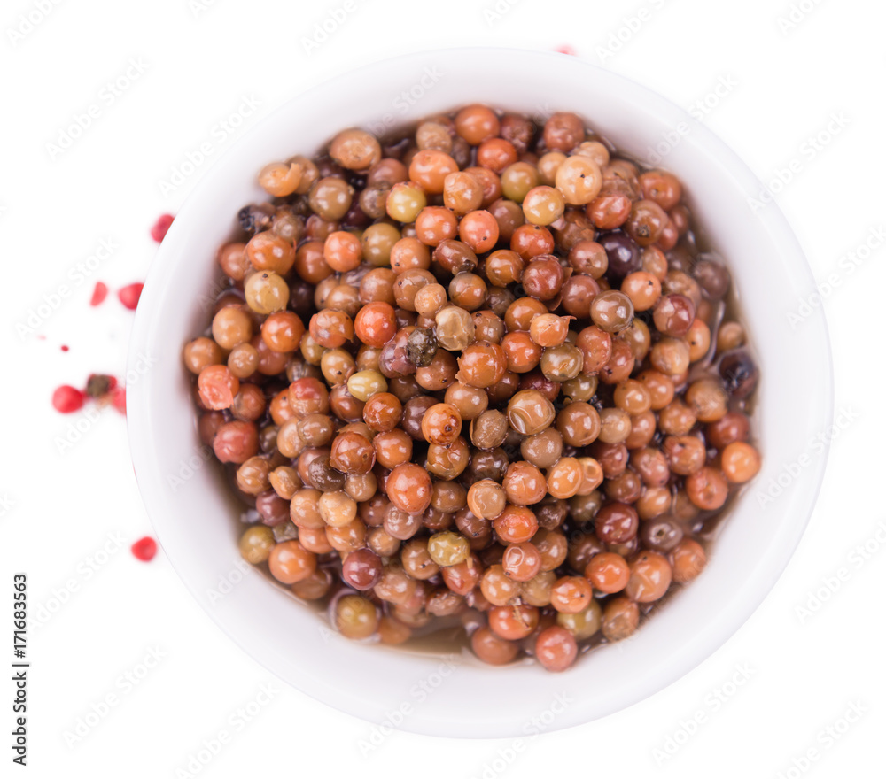 Portion of preserved Pink Peppercorns isolated on white Portion of preserved Pink Peppercorns isolated on white