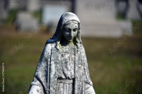 Religious statue in cemetery 