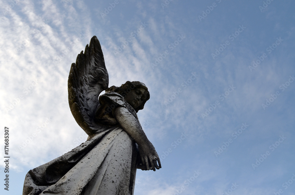 Religious statue in cemetery 