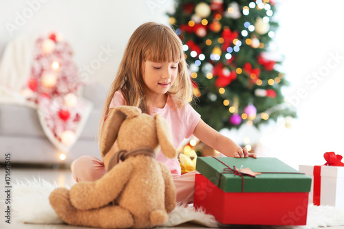 Cute little girl with toy i...
