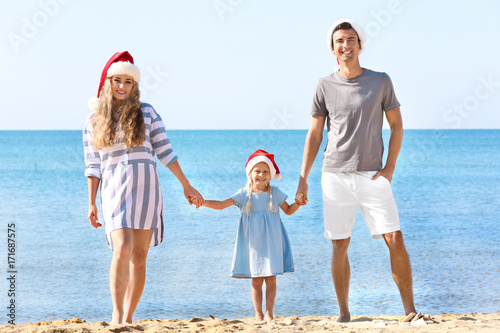 Young couple with girl on b...