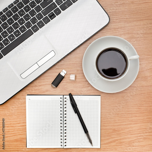  Office accessories with a laptop and a cup of coffee on the table