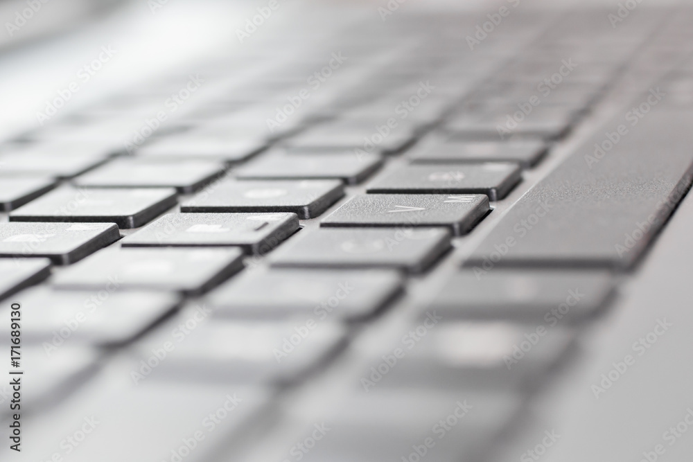 Laptop keyboard closeup in black and white tones