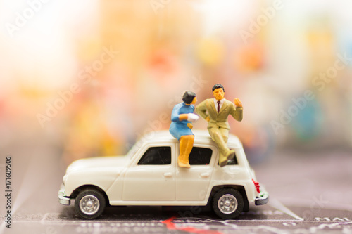 miniature couple , travel by car for travel. using as business background concept.