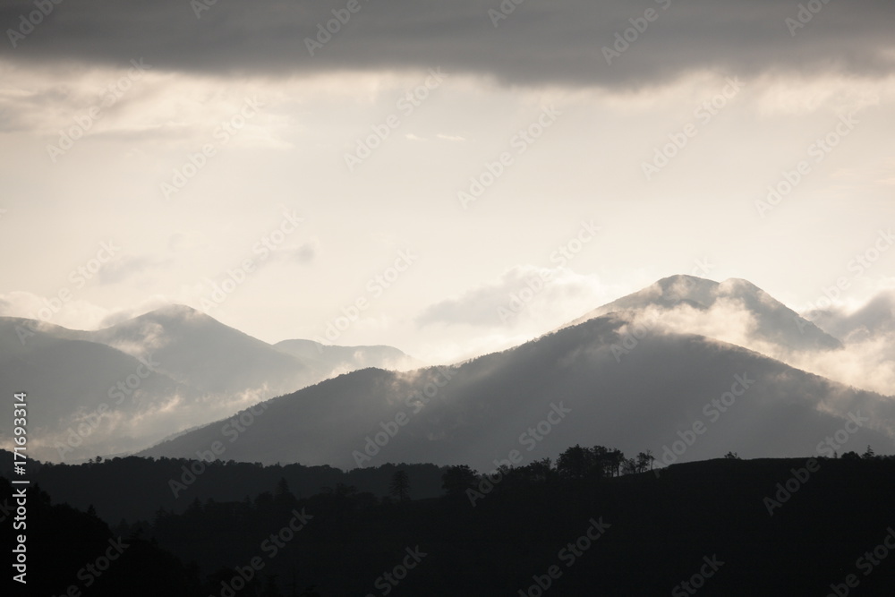 The cloud is floating above the mountains after a rain