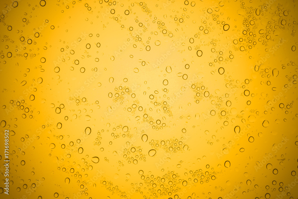 Water drops on yellow glass, Rain droplets on glass background. Water drops on yellow glass, Rain droplets on glass background.