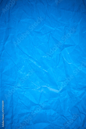 Blue paper crumpled recycle background.