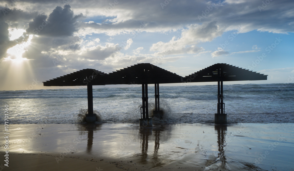 Hurricane and tropical storm. Incline weather, rain and wind. Dunes on a beach Hurricane and tropical storm. Incline weather, rain and wind. Dunes on a beach