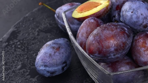 Rotating slate slab with some fresh Plums (4K footage; not loopable)