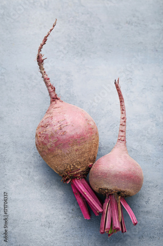 Fresh and ripe beets on grey wooden table