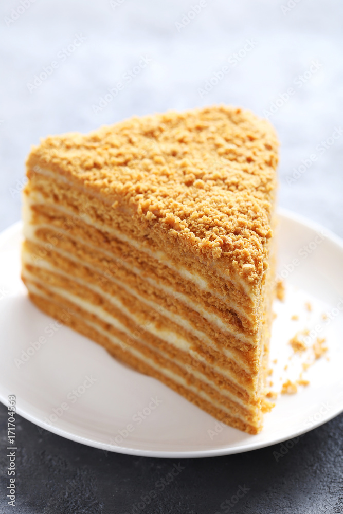 Homemade honey cake on grey wooden table Homemade honey cake on grey wooden table