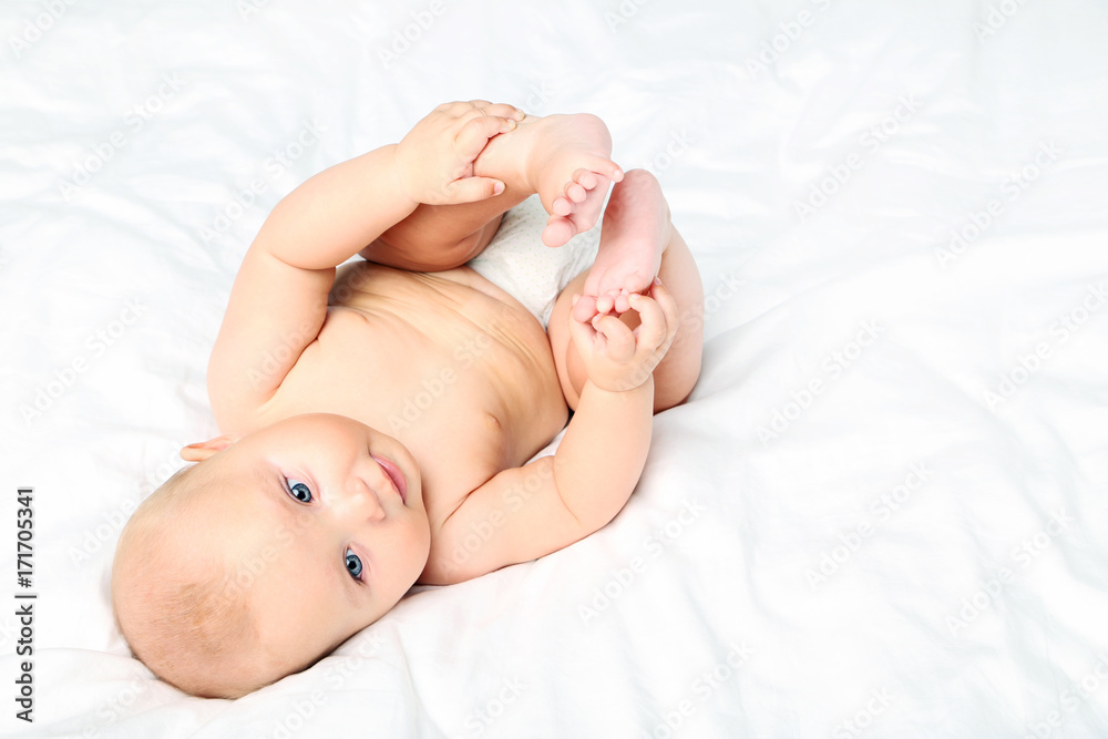 Little newborn baby on white bed Little newborn baby on white bed