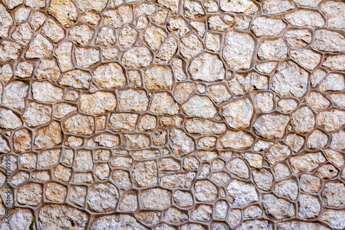 Wall background with stones framed by prominent border, relief surface texture