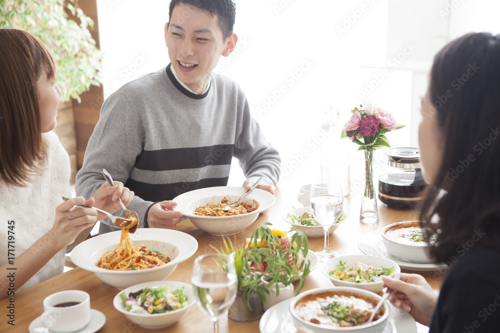 Families are eating while enjoying conversation