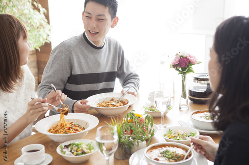Families are eating while enjoying conversation