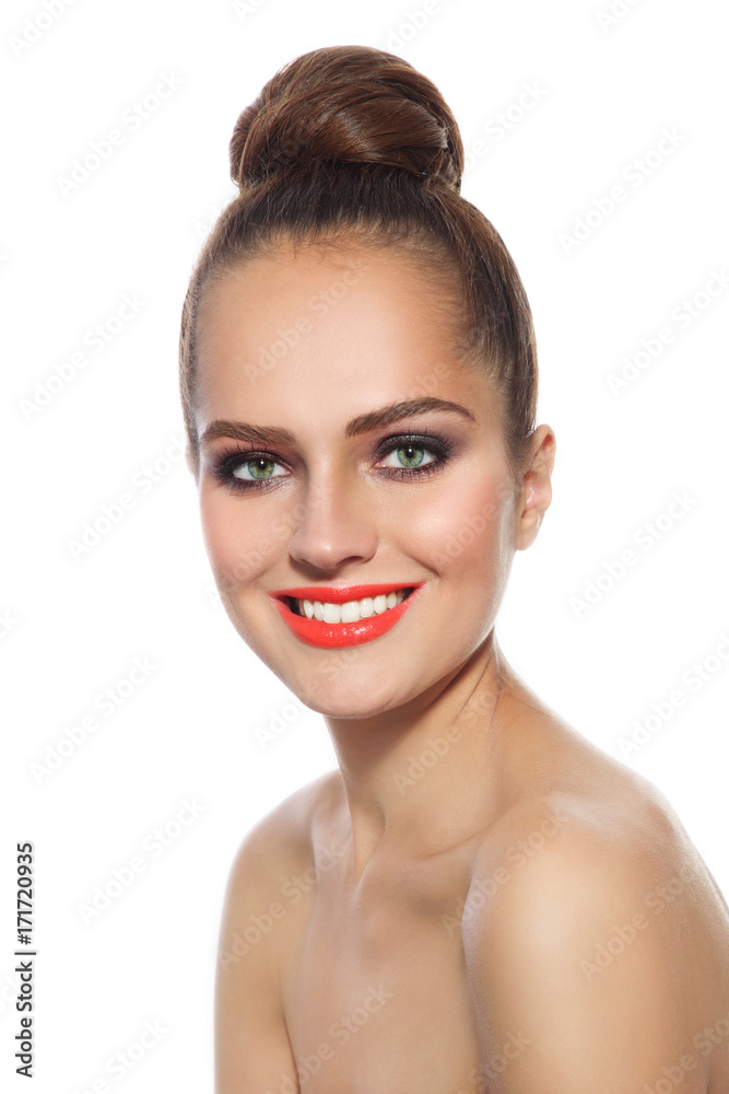 Smiling girl with hair bun Smiling girl with hair bun