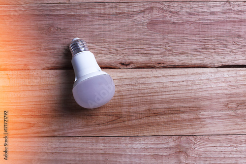 Light Bulb on wooden background