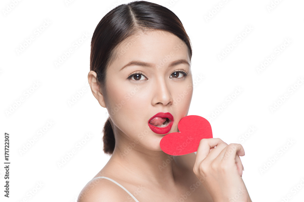 Attractive young asian woman holding red heart. Valentine's day art portrait. Perfect make up Attractive young asian woman holding red heart. Valentine's day art portrait. Perfect make up