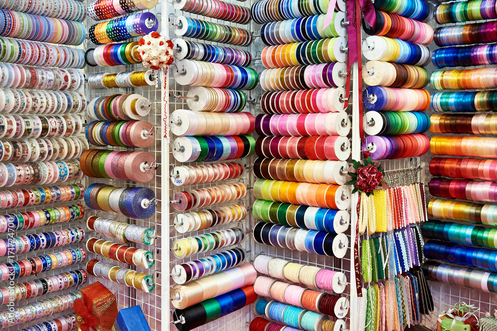 Multicolored ribbons and braid in sewing shop