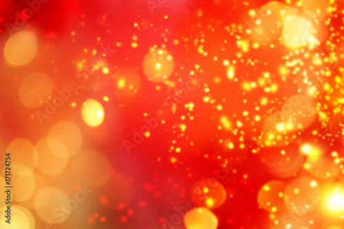 Christmas abstract red lights background. Festive xmas abstract background with bokeh defocused lights and stars. Card or invitation for your design.