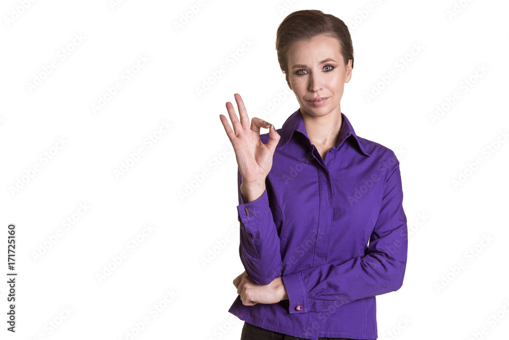 Beautiful, adult, business woman showing OK. Purple shirt. White background Beautiful, adult, business woman showing OK. Purple shirt. White background