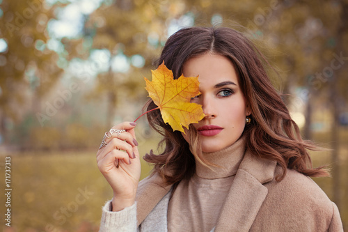 Perfect Autumn Woman Model with Brown Hair  with Fall Fashion Girl Outdoors