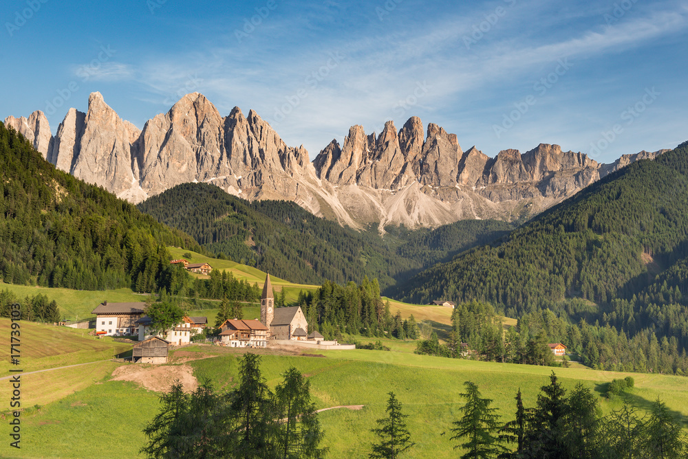 Village in front of the Geisler or Odle Dolomites Group, gruppo delle Odle, Val di Funes, Trentino Alto Adige