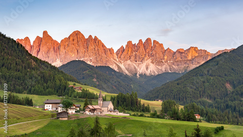 Sunset at Santa Maddalena Alta village in Dolomites, Val di Funes, Italy