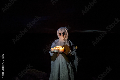 Ghost boy with candles photo