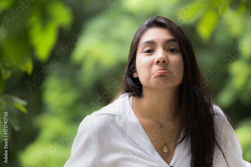 A portrait of a beautiful young asian woman in the park