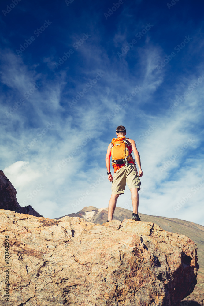 Fototapeta premium Man celebrating inspiring mountains view