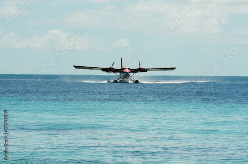 Front on View of Sea Plane taking landing on the blue crystal waters of the indian ocean