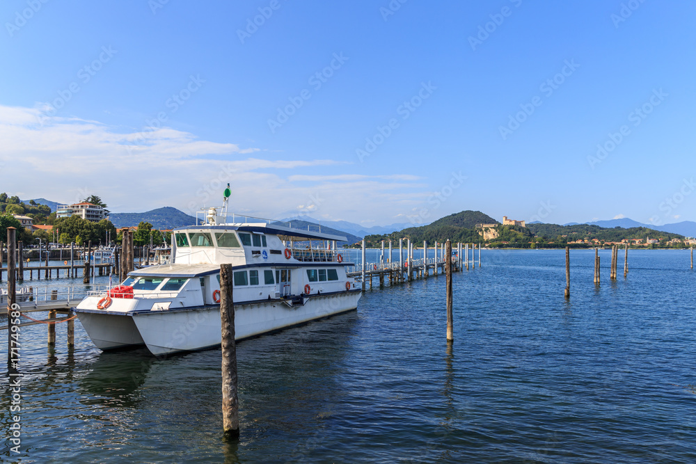 shores of Lake Maggiore with plants, sun and boats shores of Lake Maggiore with plants, sun and boats