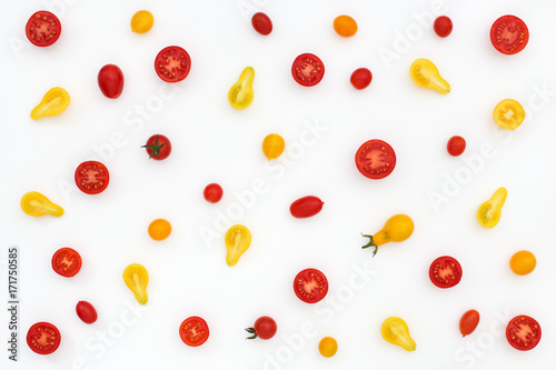 Fototapeta Naklejka Na Ścianę i Meble -  Pattern of red and yellow cherry tomatoes on white